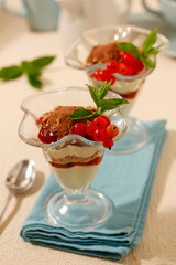 Tiramisu cups with red currants.