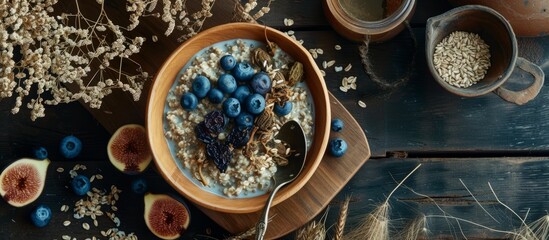 Obraz na płótnie Canvas Healthy Breakfast Meal: Nutritious Oat Bowl with Fresh Fruits on Wooden Table