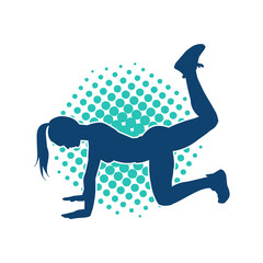Silhouette of a slim sporty woman doing pilates exercise. Silhouette of a sporty female doing physical exercise. 
