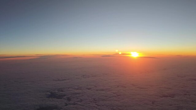 High Angle View of Beautiful Golden Sunset Above Clouds
