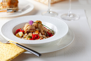 Rice dish with chicken and seasonal vegetables