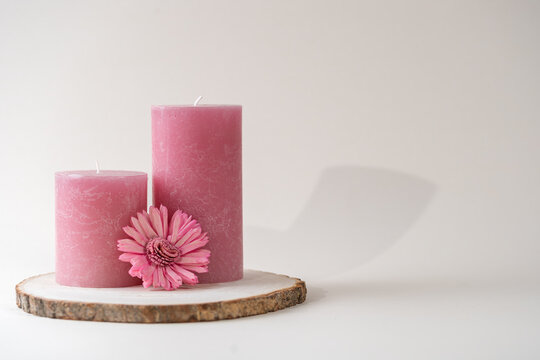 Pink Candle On A White Background