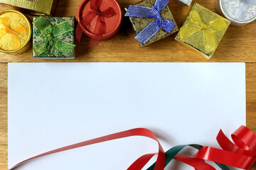 Christmas composition. Christmas gifts on wooden table. Top view, empty space, cardboard