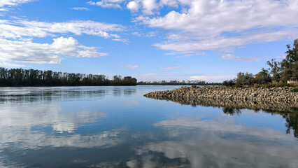 blue sky and white clouds reflected in Danube river in Vojvodina