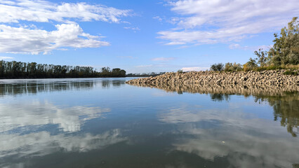 blue sky and white clouds reflected in Danube river in Vojvodina