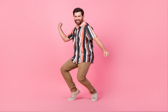 Full body length size photo of ex boyfriend young man wear striped shirt dance chill out dancing isolated on pink color background