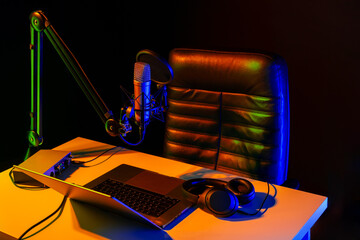 Home studio podcast interior. Microphone, table and chair