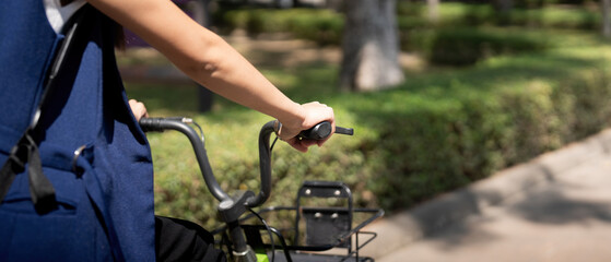Eco friendly, Happy lifestyle asian beautiful young businesswoman riding bicycle go to office work at city street with bicycle in morning