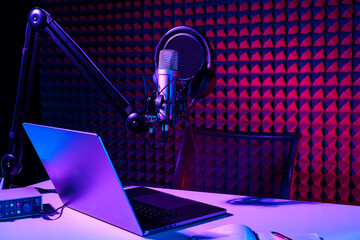 Home studio podcast interior. Microphone, table and chair