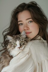 beautiful young woman cuddling with a cat, portrait, cosy vibes