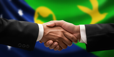 Obraz premium Businessman, diplomat in suits clasp hands for handshake over Christmas Island flag, agree on united success in trade, diplomacy, cooperation, negotiation, teamwork in commerce, gesture of greeting