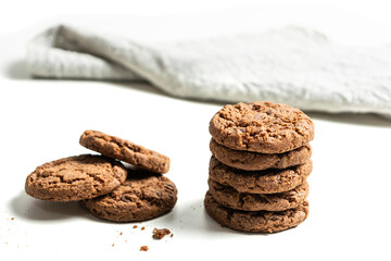 stack of dark chocolate cookies isolated on a white background