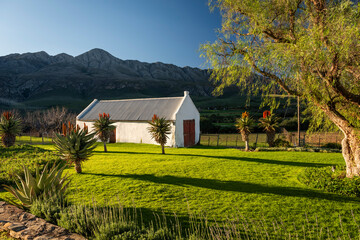 Farm in the Karoo with old rural houses and the swartberg mountains in south africa,