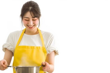 エプロンを着て料理をする日本人女性（クッキング・キッチン・手料理）