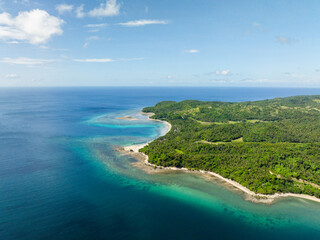 Turquoise sea water with corals in tropical beaches. Santa Fe, Tablas, Romblon. Philippines.