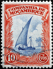 Old sailboat on vintage stamp from Mozambique