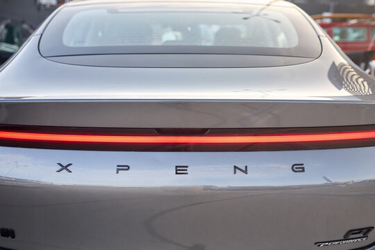 Berlin, Germany - August 20, 2022: Car Detail Xpang Performance P7 Motors electric car back badge emblem logo. X Peng Xiaoping is a Chinese EV company. Translation: Xiaopeng or XPeng.
