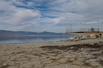 Fototapeta na wymiar Metal pier in Lake Burdur, which is moving away from the lake due to drought.
