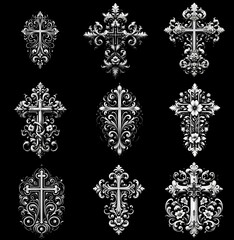 Graceful crosses: timeless engravings on black granite. Black and white image on a black background