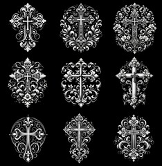 Graceful crosses: timeless engravings on black granite. Black and white image on a black background
