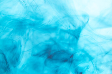 water soluble blue photograph There are patterns created by the flow of colors in the water.