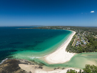 High angle aerial drone view of Sailors Grave Beach and Collingwood Beach in Vincentia, a beachside suburb in Jervis Bay Territory and on the South Coast of New South Wales, Australia.