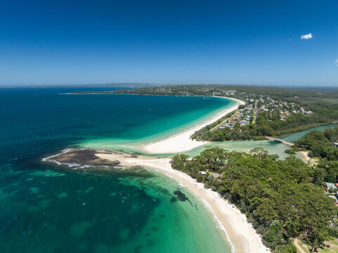 High angle aerial drone view of Huskisson Beach and Collingwood Beach in Huskisson and Vincentia, beachside suburbs in Jervis Bay Territory and on the South Coast of New South Wales, Australia.