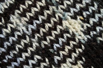 Handmade knitted fabric white brown wool background texture