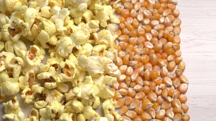 Caramel Popcorn is isolated on wooden background. Salted popcorn on the wooden table.