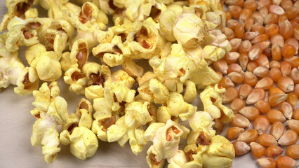 Caramel Popcorn is isolated on wooden background. Salted popcorn on the wooden table.