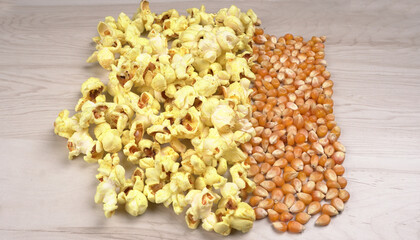 Caramel Popcorn is isolated on wooden background. Salted popcorn on the wooden table.