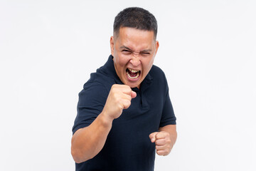 A middle aged man yelling while challenging someone to a fistfight. Studio shot, white background.