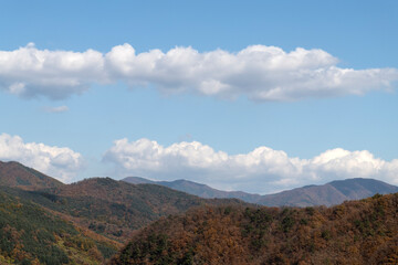 White clouds on the autumn mountains