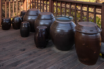 The traditional ceramic jars on the wooden floor