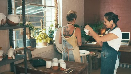 Ceramic store, happy people and check cup design, mug or electric kiln results for quality assurance in pottery production. Assessment, commerce business and team smile for inspection of art product