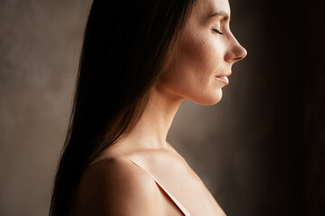 Fototapeta premium Profile side no filter photo of gorgeous lady anti age effect plastic surgery aesthetic beauty isolated on grey concrete wall background