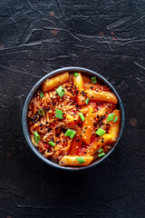 Rabokki, tteokbokki or topokki with ramen, Korean street food, spicy rice cakes in red pepper gochujang sauce, overhead flat lay shot - 746526673