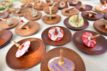 Different hand-made martisoare featuring flowers, animals, birds, geometric shapes are exhibited in a fair and offered for sale to the public with the occasion of March 1, symbol rebirth of spring.