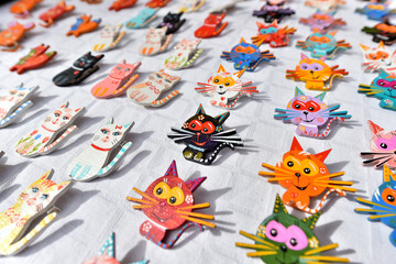 Different hand-made martisoare featuring flowers, animals, birds, geometric shapes are exhibited in a fair and offered for sale to the public with the occasion of March 1, symbol rebirth of spring.