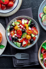 Greek salad. Fresh tomato, cucumber, bell pepper, Feta cheese, onion, and olives. Healthy summer food, overhead flat lay shot - 746528239