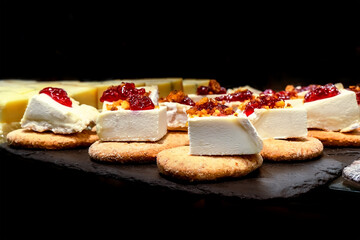 Tapas and pinchos at a food market in Spain. Traditional Spanish gastronomy. Finger food, travelling in Europe