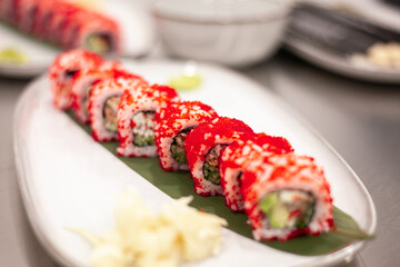 California sushi roll on a plate with decoration