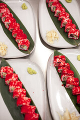 California sushi roll on a plate with decoration