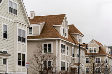 Newly built single-family houses on a winter day in Brighton, MA, USA