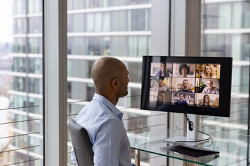 Businessman Using Video Conferencing technology for video call with colleagues working remotely