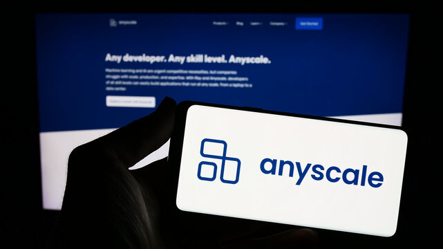 Stuttgart, Germany - 02-15-2024: Person holding smartphone with logo of US AI infrastructure company Anyscale Inc. in front of website. Focus on phone display.