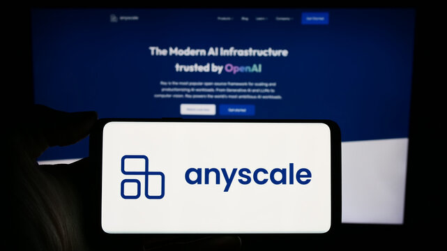 Stuttgart, Germany - 02-15-2024: Person holding cellphone with logo of US AI infrastructure company Anyscale Inc. in front of business webpage. Focus on phone display.