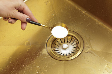 Cleaning kitchen sink with bakIng soda to keep sinks draining well and prevent clogs. Safe,...