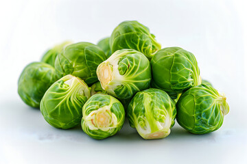 Fototapeta premium Small heap of brussels sprouts on white background