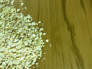 Partial view of Rolled oats on wooden table
